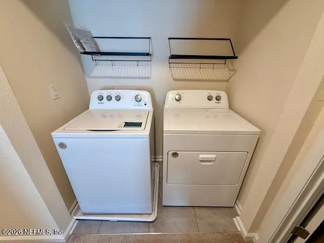 a utility room with dryer and washer