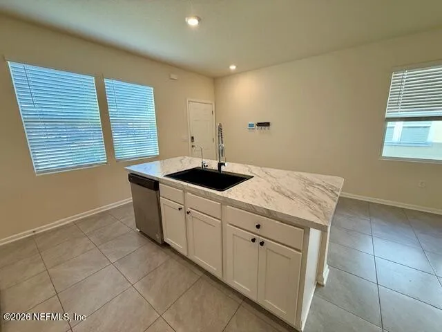 a kitchen with a sink and cabinets