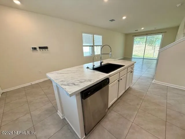 a kitchen with a stove top oven and sink