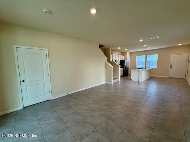 a view of a hallway with seating area