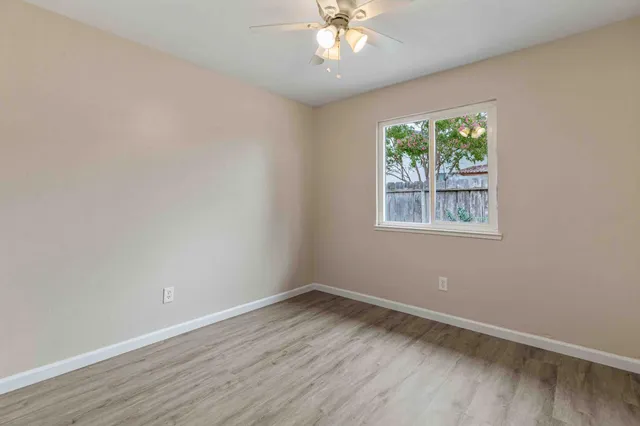 a view of a big room with a window