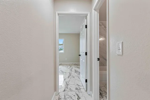 a view of wooden floor and chandelier in a room