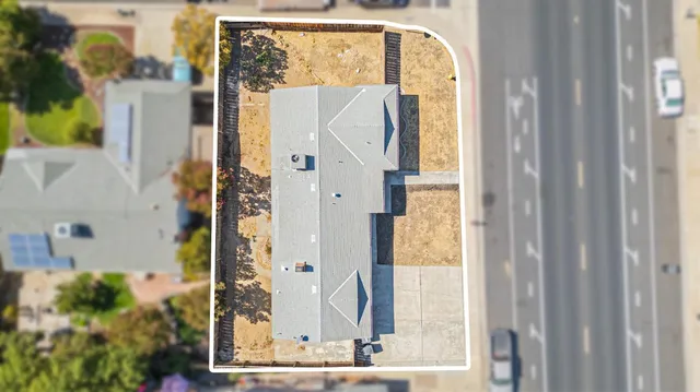 a view of living room with furniture and floor to ceiling window
