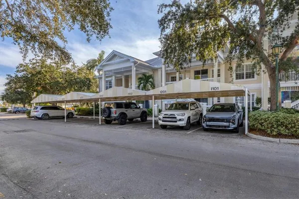 a view of a cars parked in front of a house
