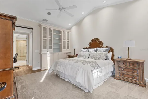 a bedroom with a bed and a dresser