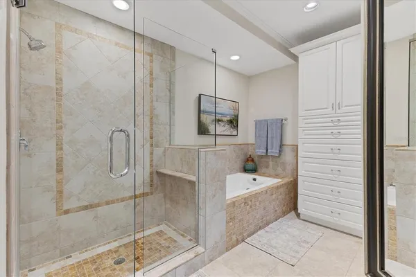 a bathroom with a bathtub and a shower