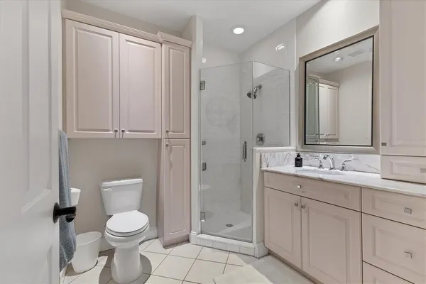 a room with pool table and windows