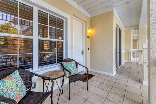 a view of a livingroom with furniture and a porch