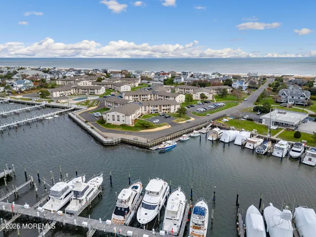 an aerial view of a house with a ocean view