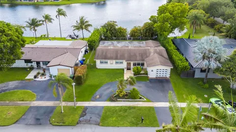an aerial view of house with yard swimming pool and outdoor seating