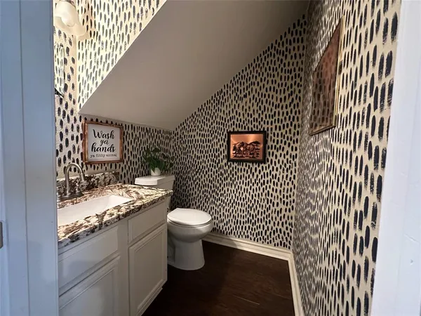 a bathroom with a sink and a toilet