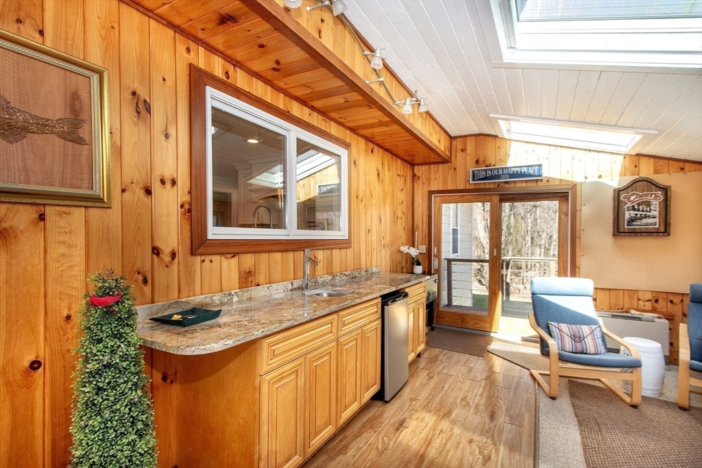 18 Longmeadow Road Scituate, MA 02066 - Photo 20 of 37 a bathroom with a granite countertop sink and large windows