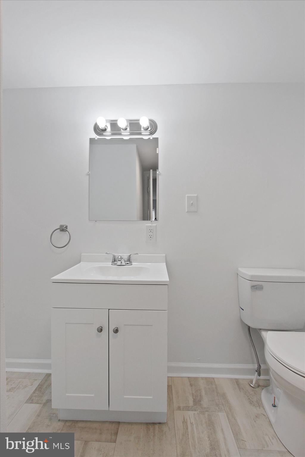 534 Hunterstown Road Gettysburg, PA 17325 - Photo 7 of 18 a bathroom with a sink a toilet and mirror