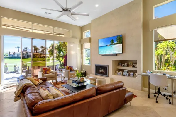 a living room with furniture and a large window