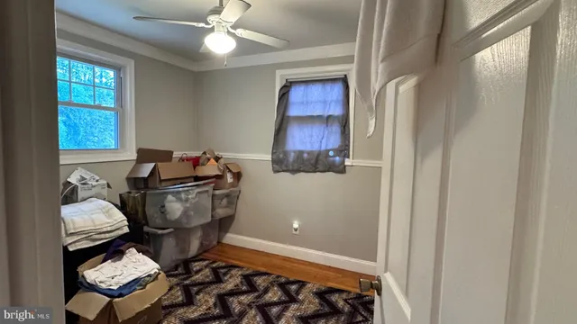 a bathroom with a toilet and a shower curtain
