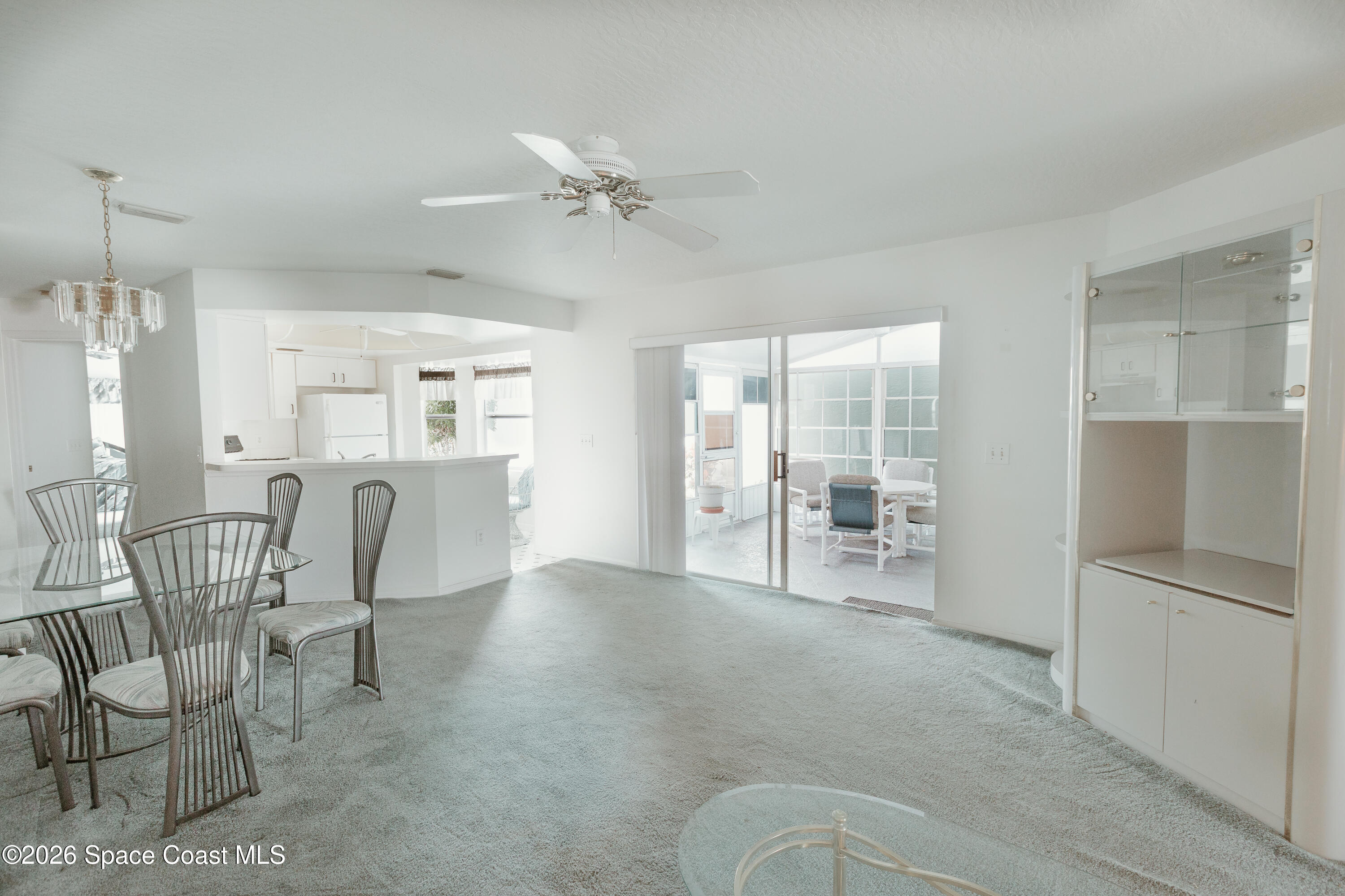 905 Maplewood Court Melbourne, FL 32940 - Photo 14 of 23 a view of a livingroom with furniture and a ceiling fan