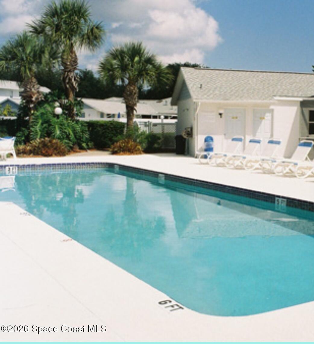 905 Maplewood Court Melbourne, FL 32940 - Photo 19 of 23 a view of swimming pool from a lake view