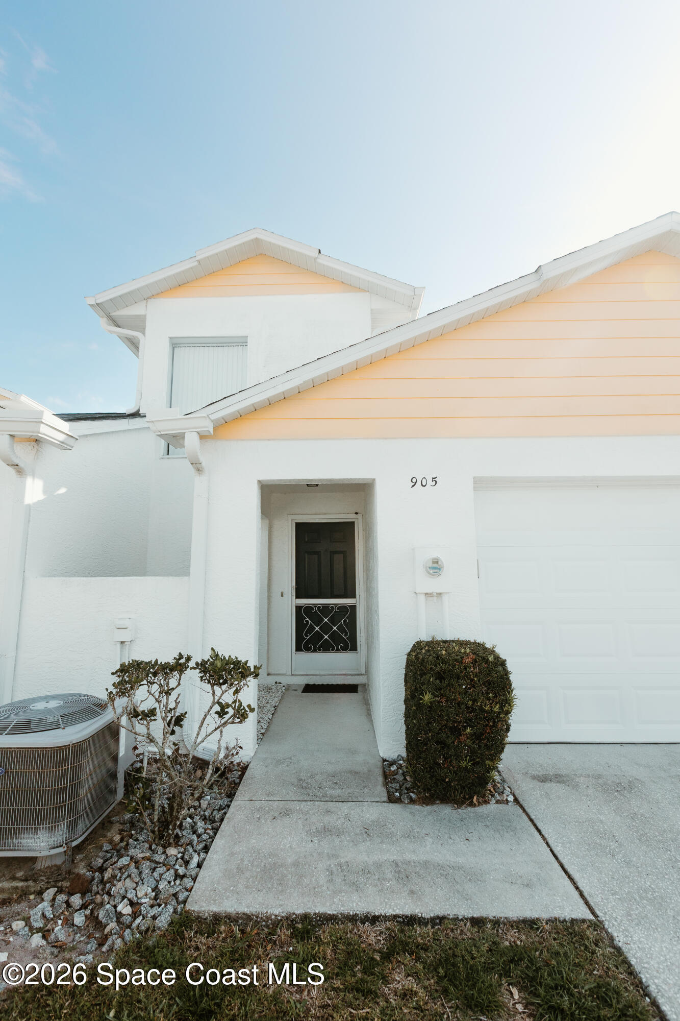 905 Maplewood Court Melbourne, FL 32940 - Photo 2 of 23 a view of an empty room and fire place