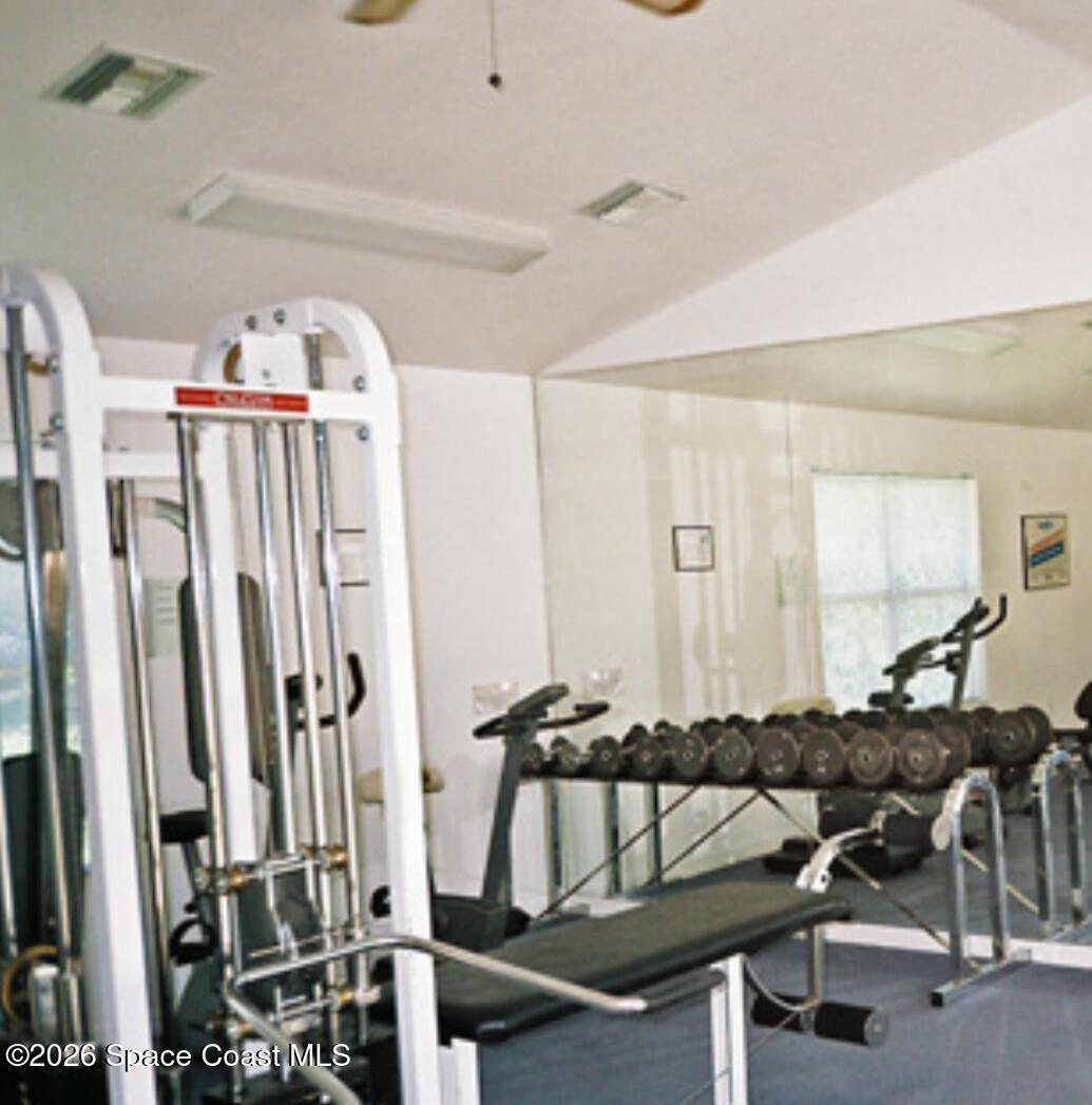 905 Maplewood Court Melbourne, FL 32940 - Photo 21 of 23 a view of a room with gym equipment