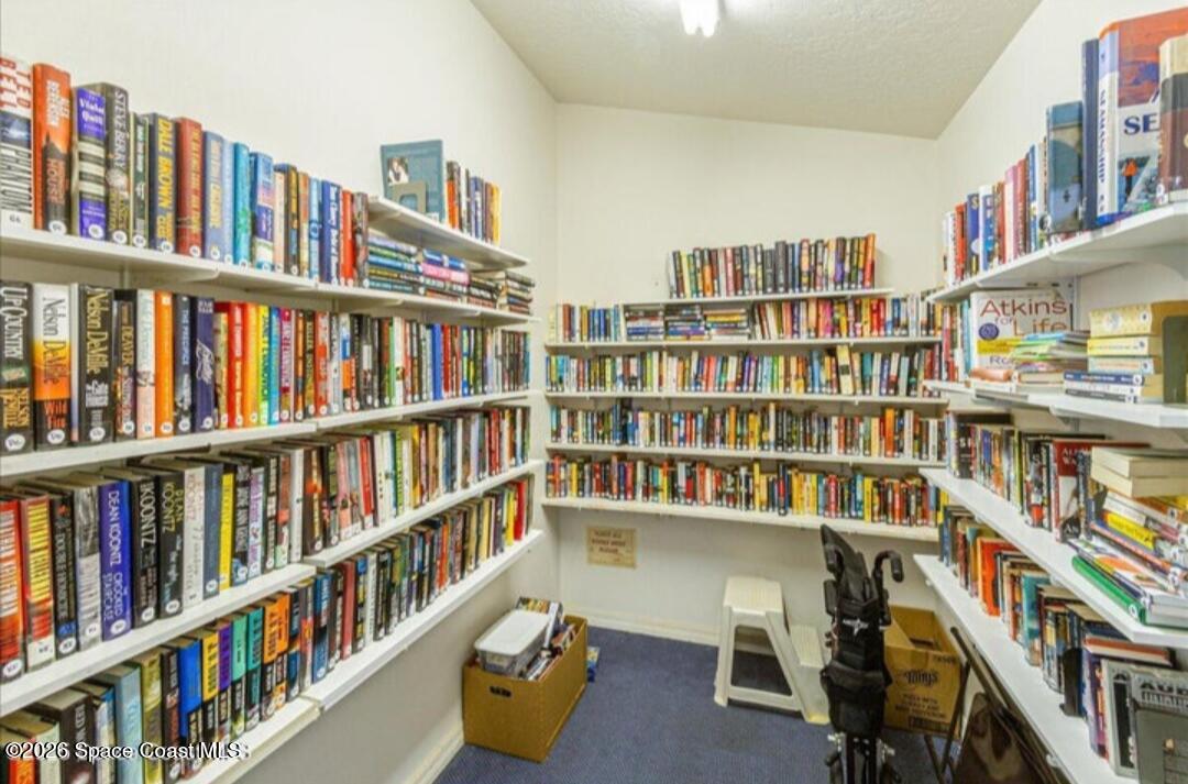 905 Maplewood Court Melbourne, FL 32940 - Photo 22 of 23 a book shelf with books and a book shelf