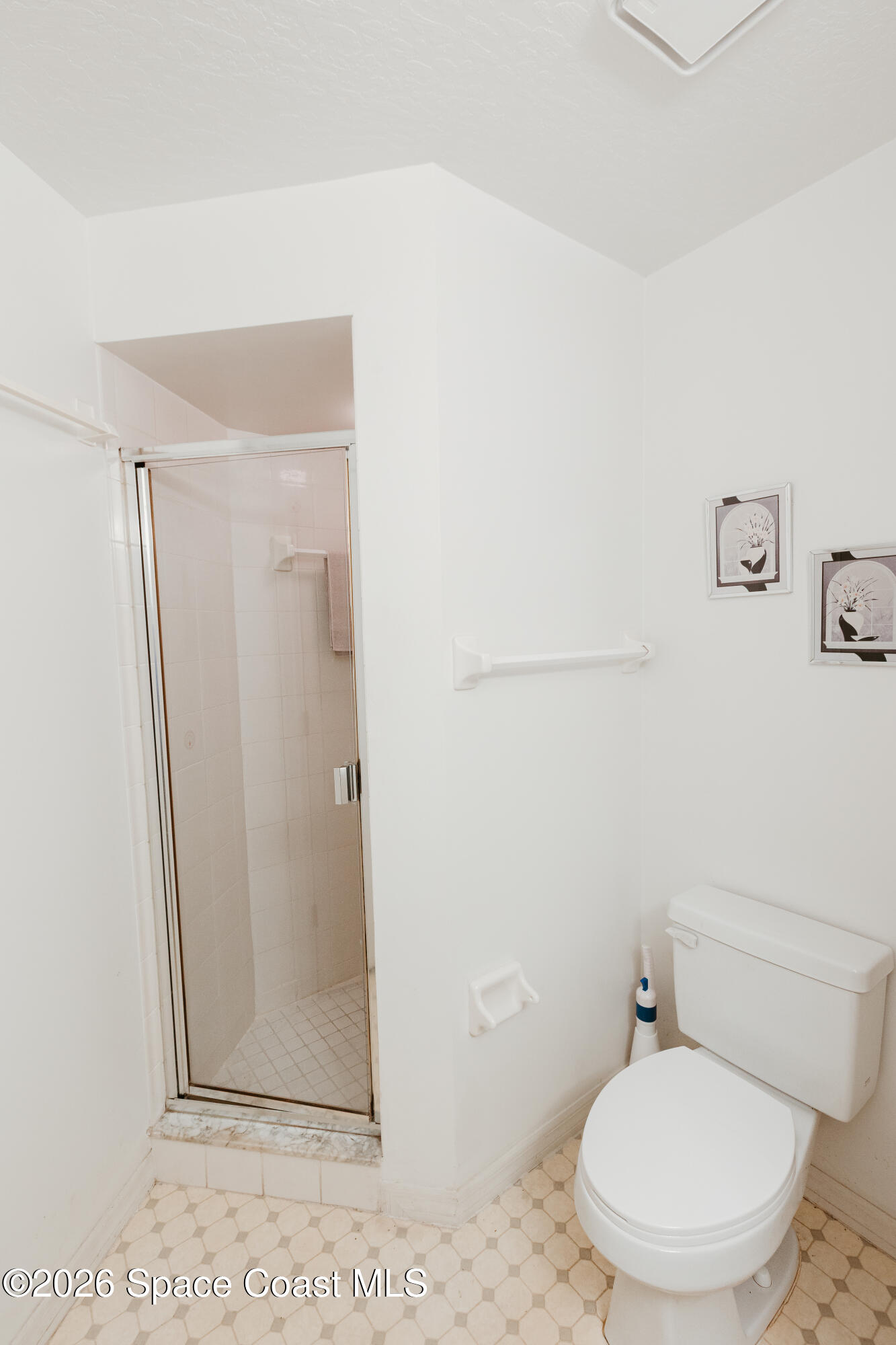 905 Maplewood Court Melbourne, FL 32940 - Photo 10 of 23 a white toilet sitting next to a shower