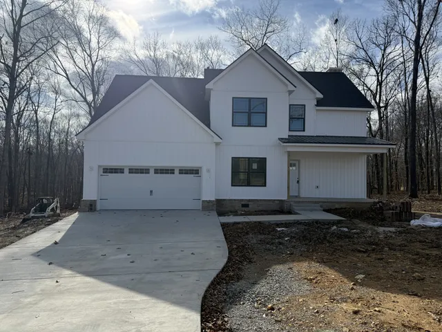 a view of a wooden fence next to a yard