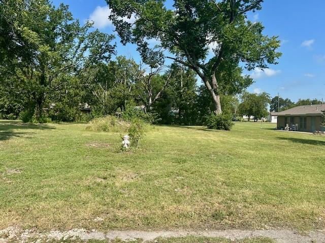 a swimming pool with trees in the background
