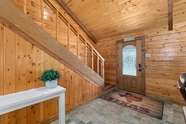 a view of entryway with a front door