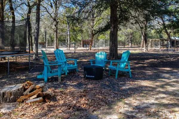 a view of a table and chairs in the garden