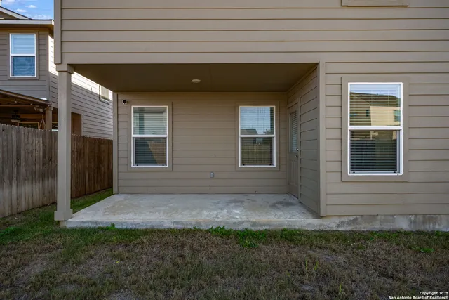 a backyard of a house with lots of green space