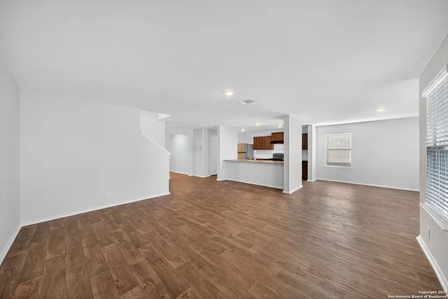 a view of a kitchen with wooden floor