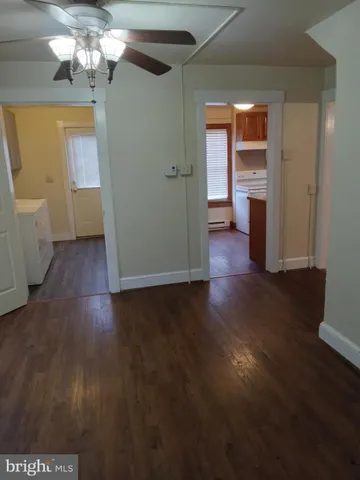 a view of a livingroom with wooden floor
