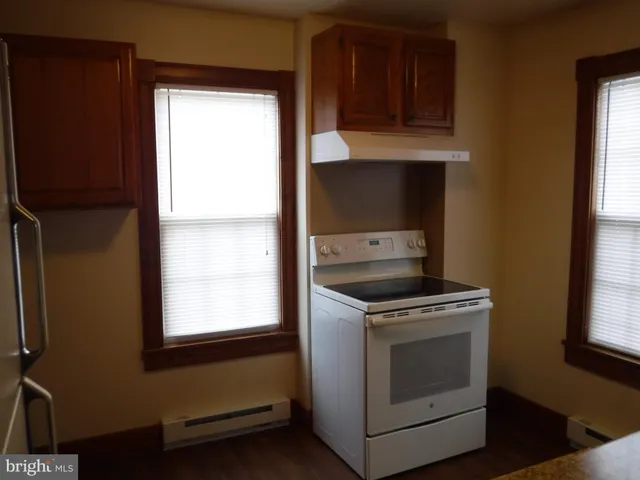 a kitchen with a stove and a microwave
