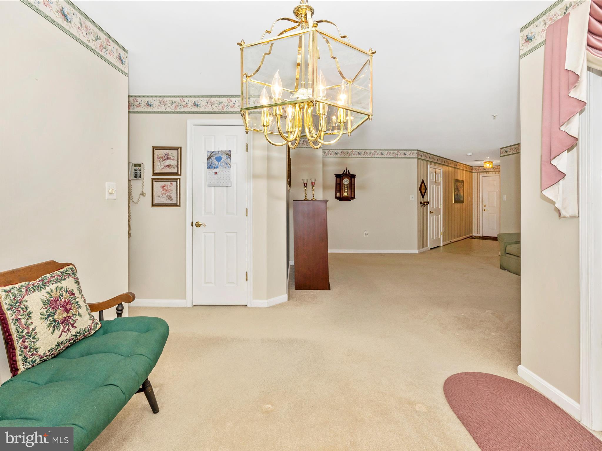 2501 Coach House Way, Unit 2C Frederick, MD 21702 - Photo 11 of 54 a view of a livingroom with furniture and a chandelier