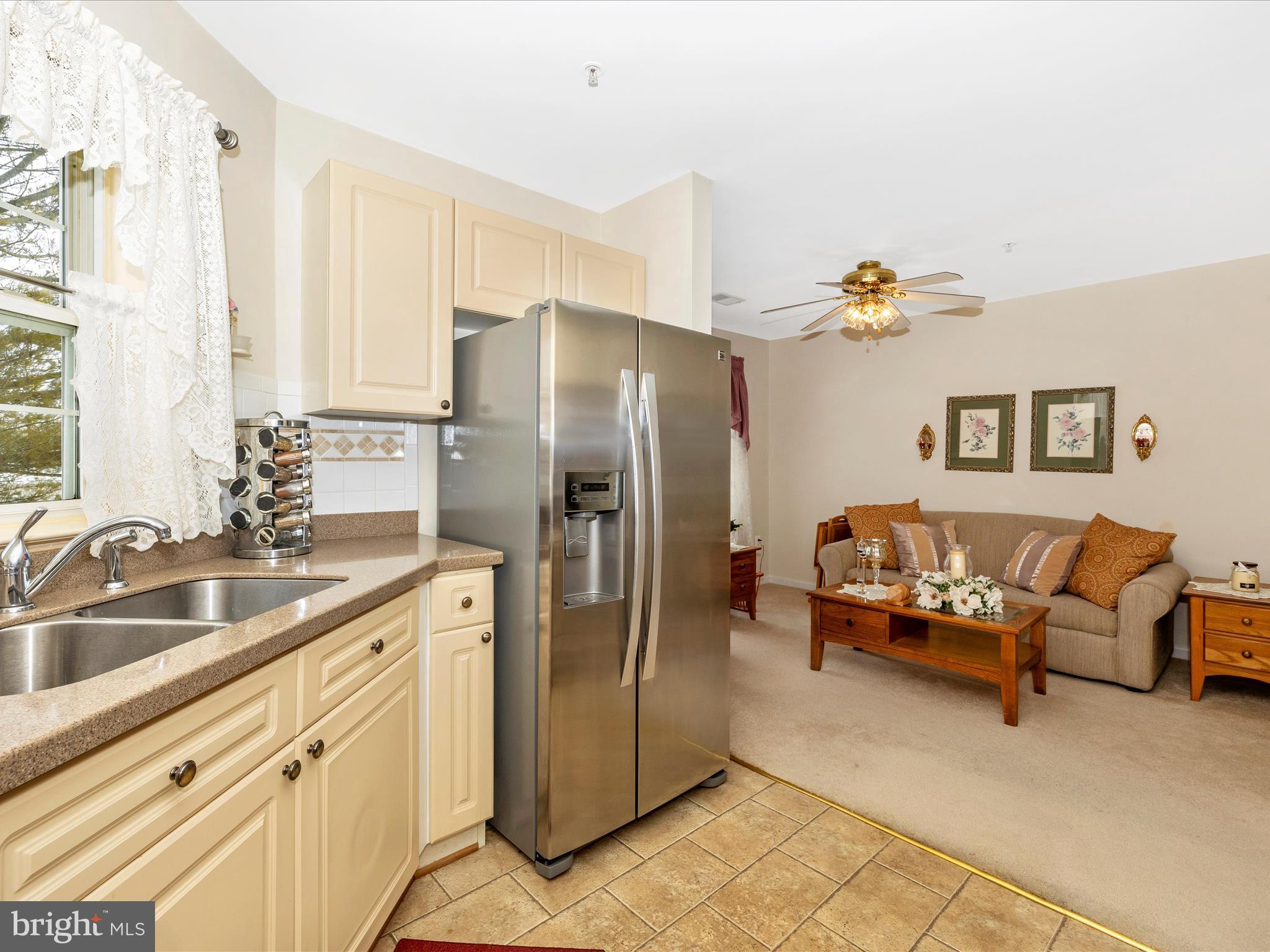 2501 Coach House Way, Unit 2C Frederick, MD 21702 - Photo 17 of 54 a kitchen with granite countertop a refrigerator and a sink