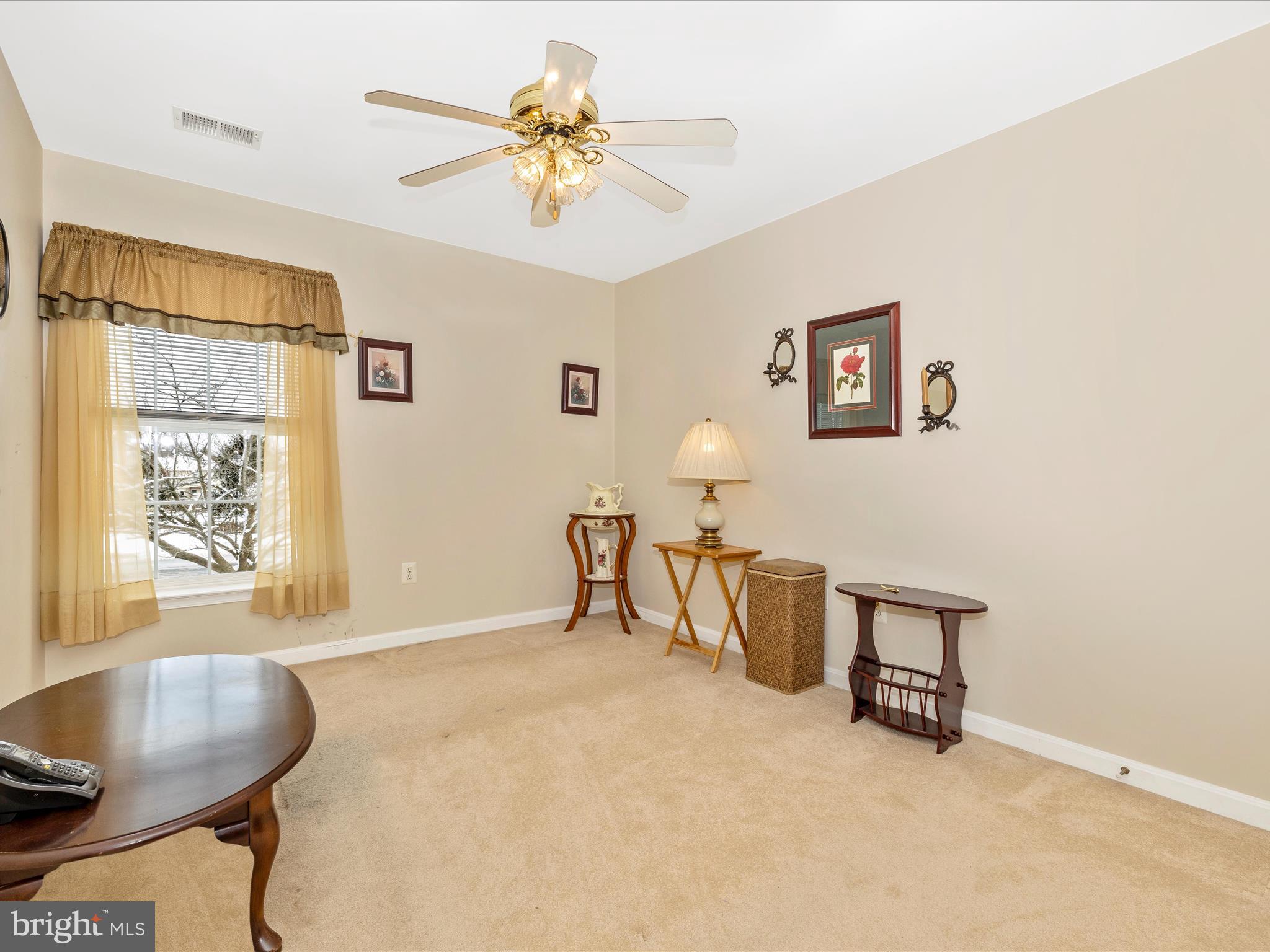 2501 Coach House Way, Unit 2C Frederick, MD 21702 - Photo 32 of 54 a view of a livingroom with furniture and a window