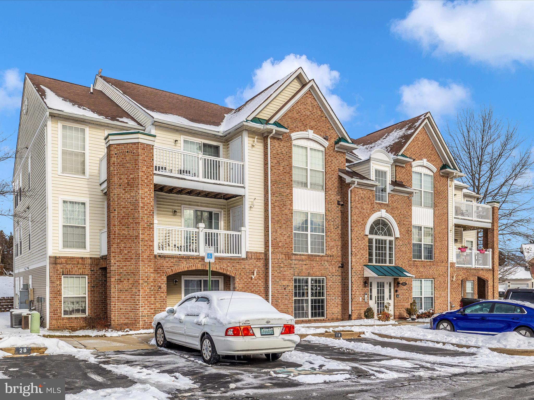 2501 Coach House Way, Unit 2C Frederick, MD 21702 - Photo 38 of 54 a car parked in front of a building