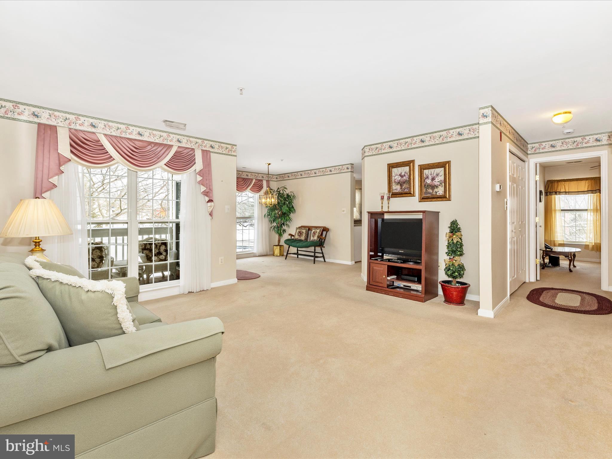 2501 Coach House Way, Unit 2C Frederick, MD 21702 - Photo 4 of 54 a living room with furniture and a flat screen tv