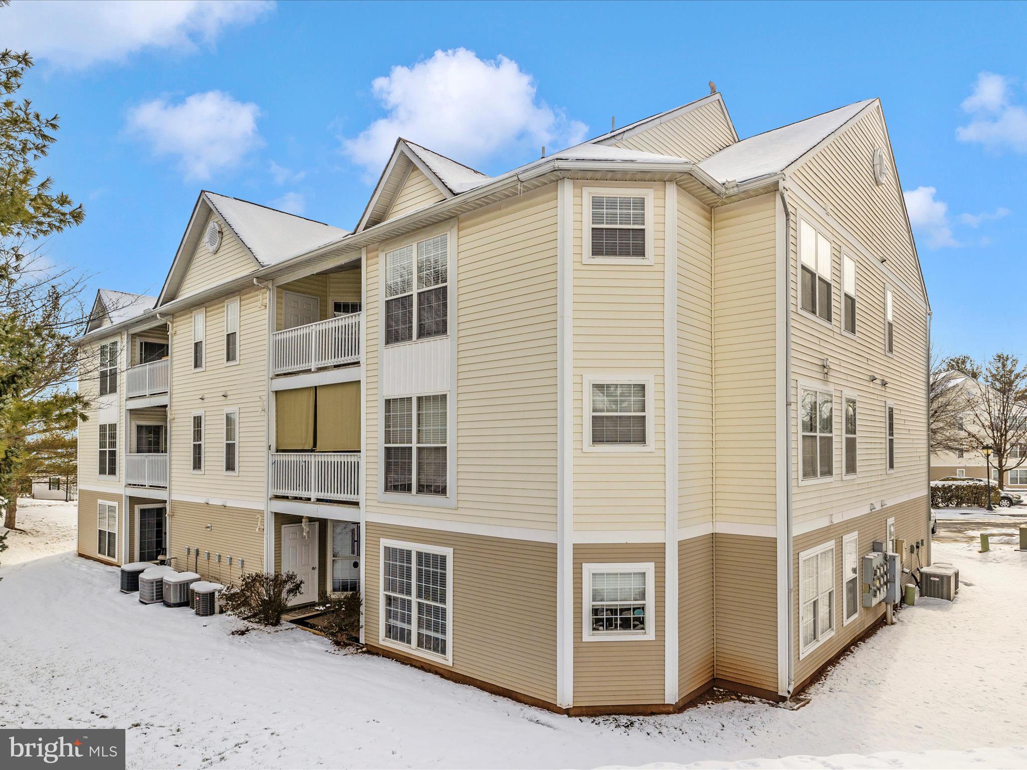 2501 Coach House Way, Unit 2C Frederick, MD 21702 - Photo 42 of 54 a front view of a building with glass windows