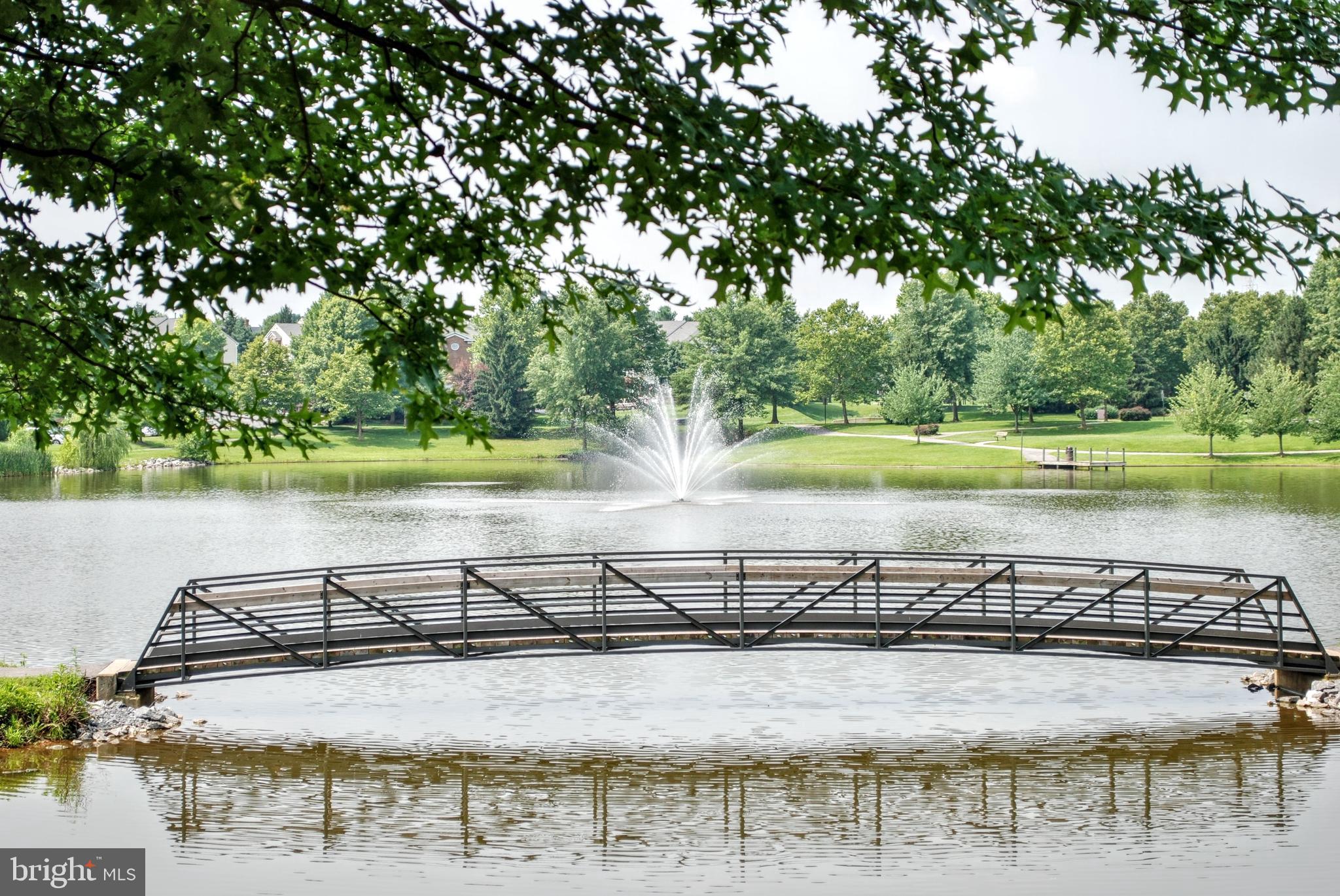 2501 Coach House Way, Unit 2C Frederick, MD 21702 - Photo 46 of 54 a view of a ocean with a mountain and trees in the background