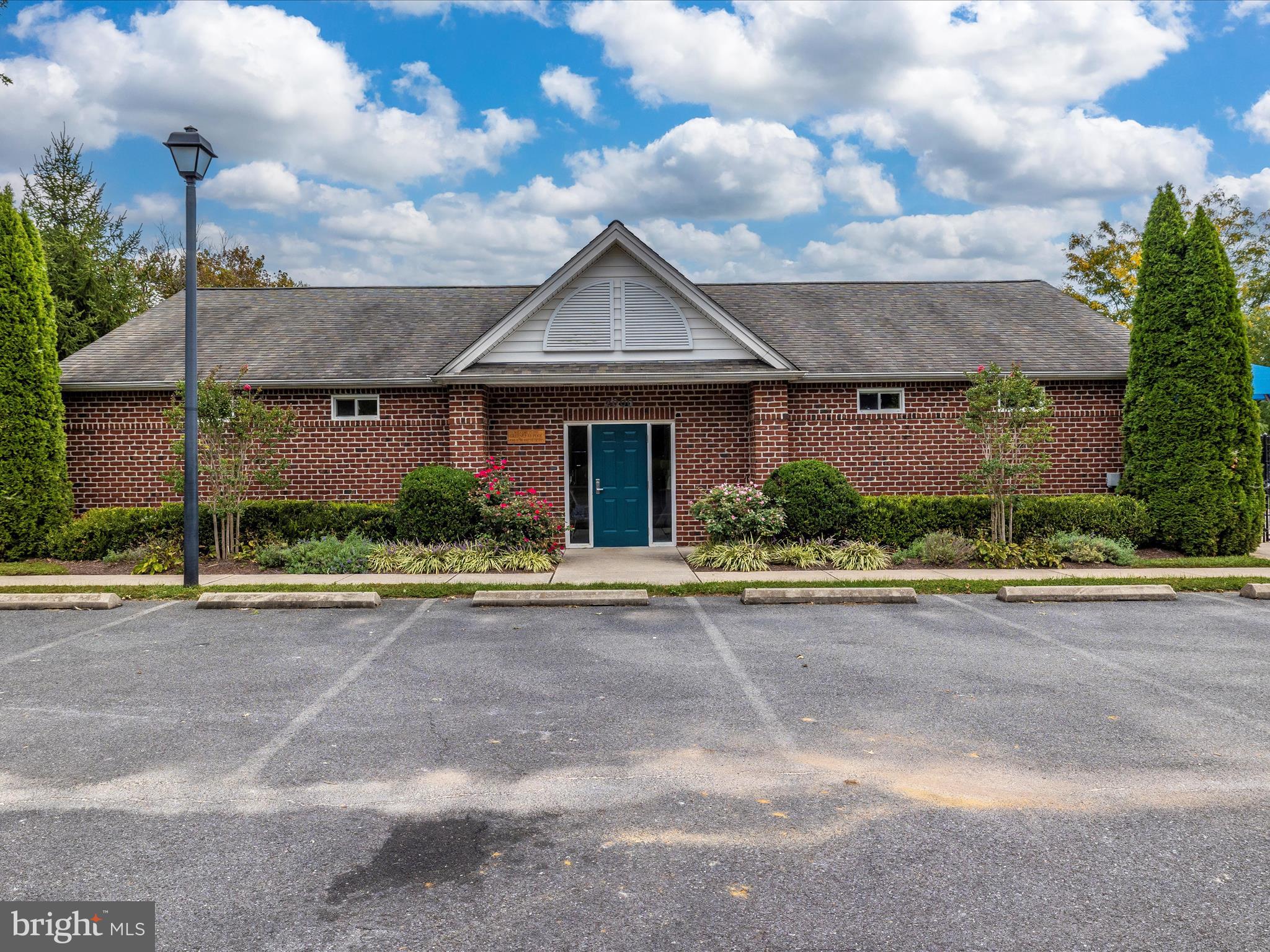 2501 Coach House Way, Unit 2C Frederick, MD 21702 - Photo 53 of 54 a front view of house with a yard