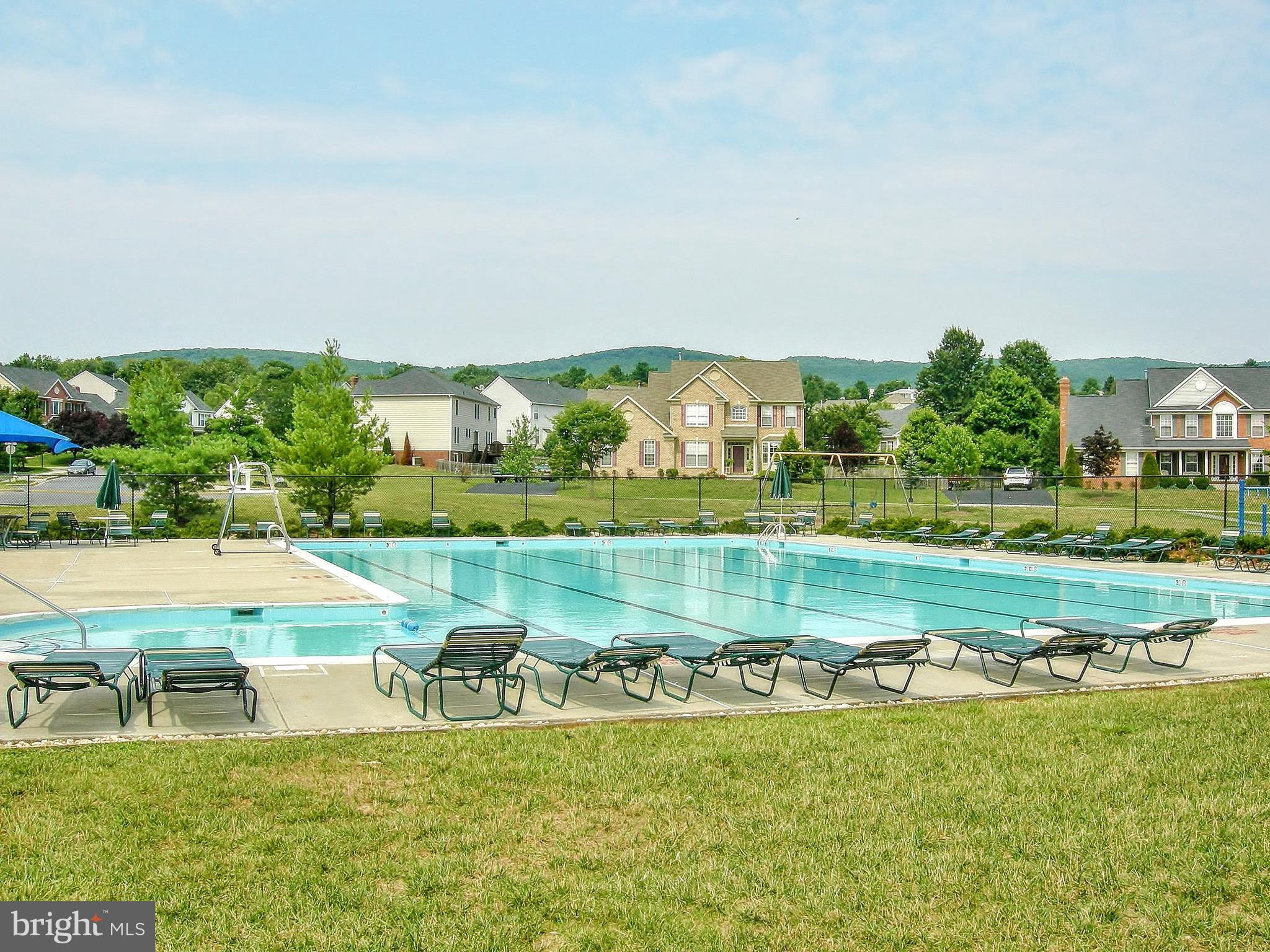 2501 Coach House Way, Unit 2C Frederick, MD 21702 - Photo 54 of 54 a view of a swimming pool with a garden and plants