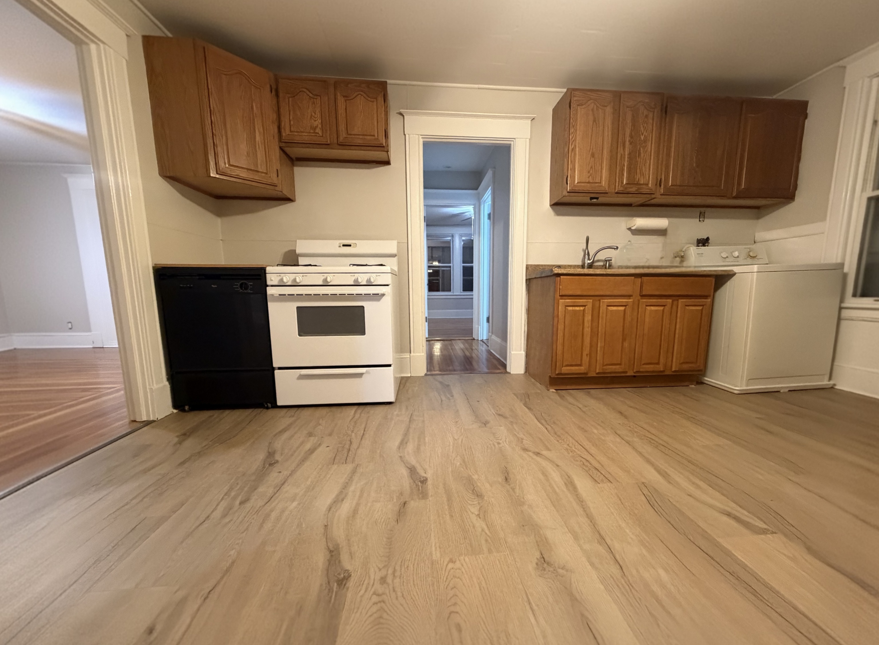 114 Wallace Street, Unit 3 New Britain, CT 06051 - Photo 2 of 11 a kitchen with stainless steel appliances granite countertop a stove a sink and a refrigerator