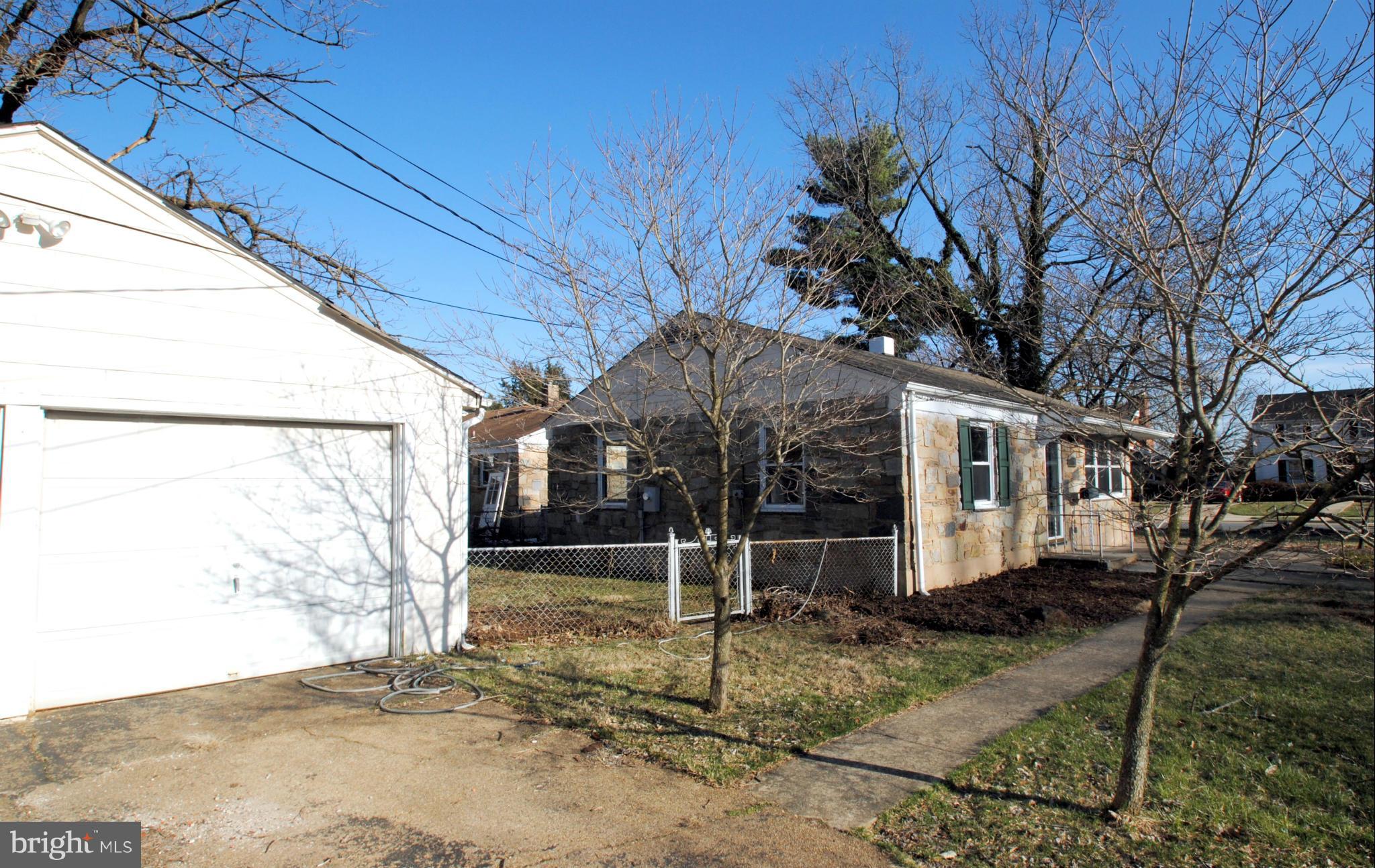 716 Milford Mill Road Baltimore, MD 21208 - Photo 2 of 19 a view of a house with a tree
