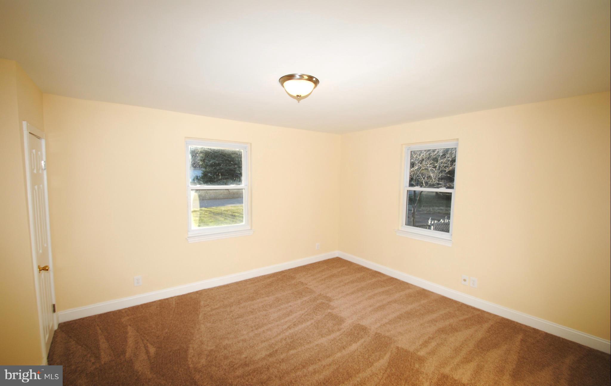716 Milford Mill Road Baltimore, MD 21208 - Photo 15 of 19 a view of a bedroom with a window