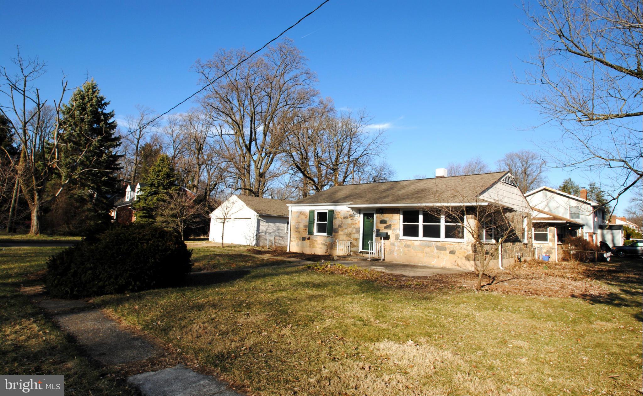 716 Milford Mill Road Baltimore, MD 21208 - Photo 18 of 19 a front view of a house with a yard