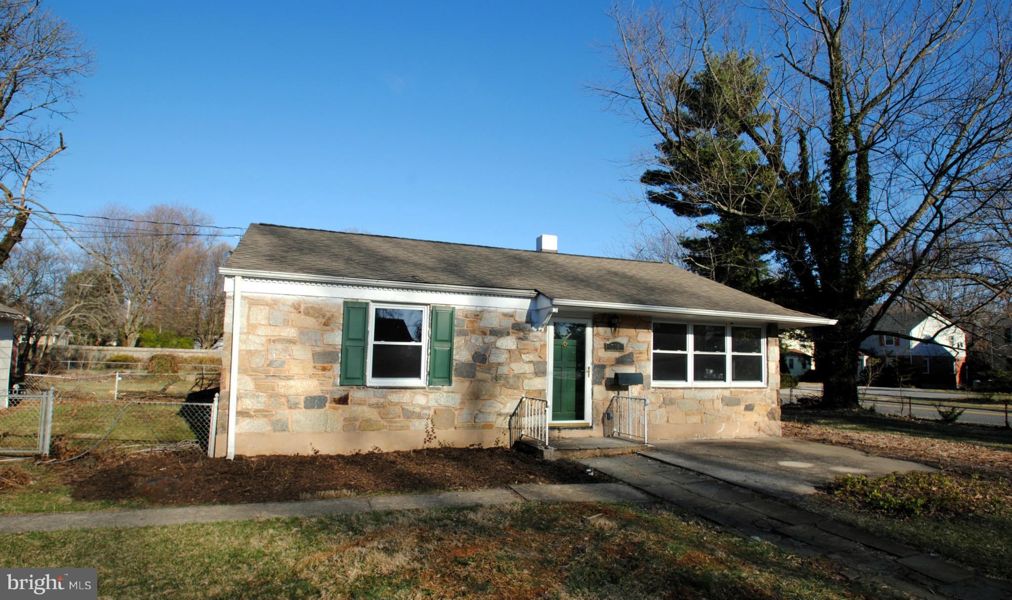 716 Milford Mill Road Baltimore, MD 21208 - Photo 4 of 19 a front view of a house with yard