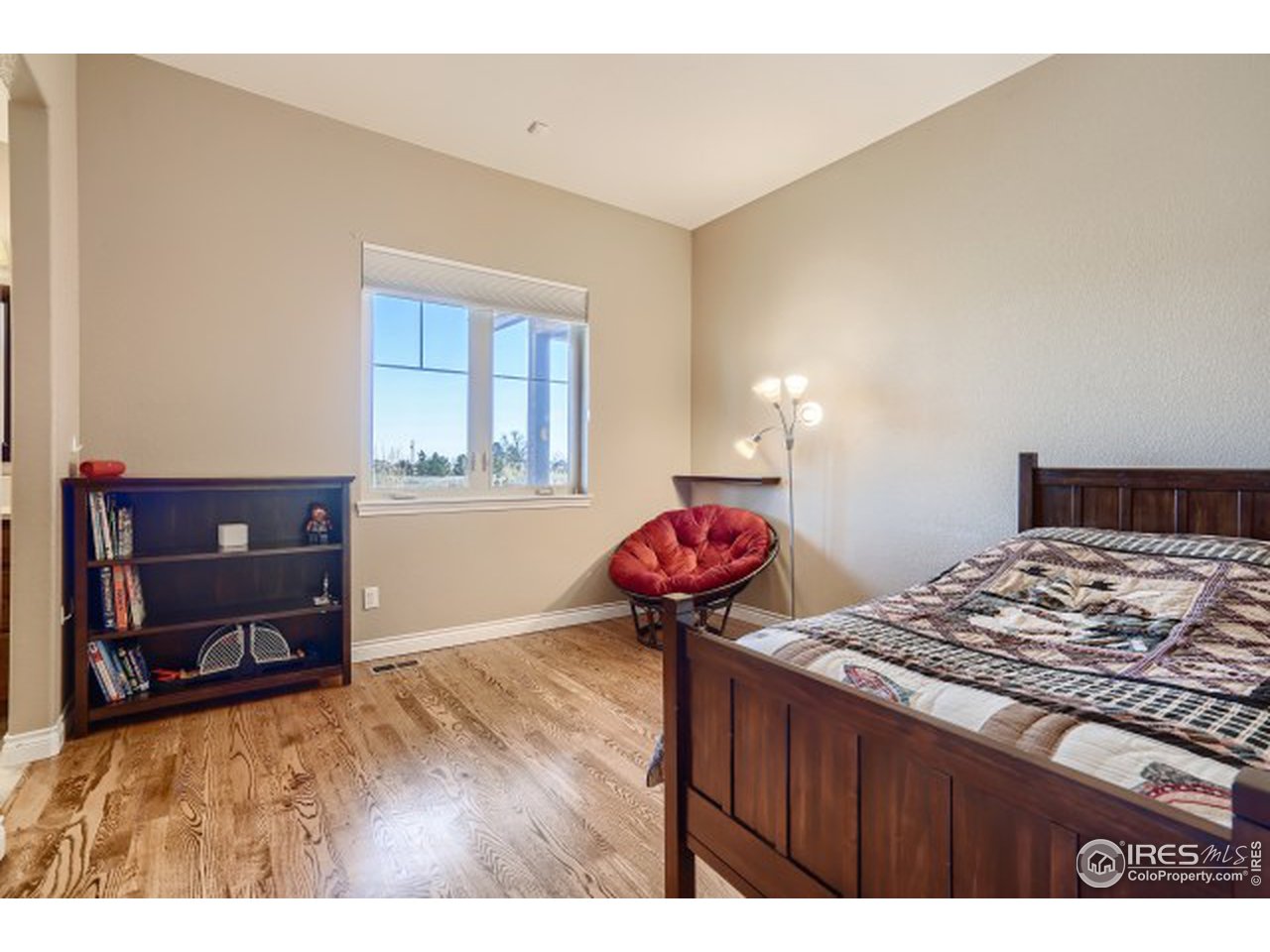 9670 Phillips Road Lafayette, CO 80026 - Photo 17 of 33 a bedroom with a bed and a dresser