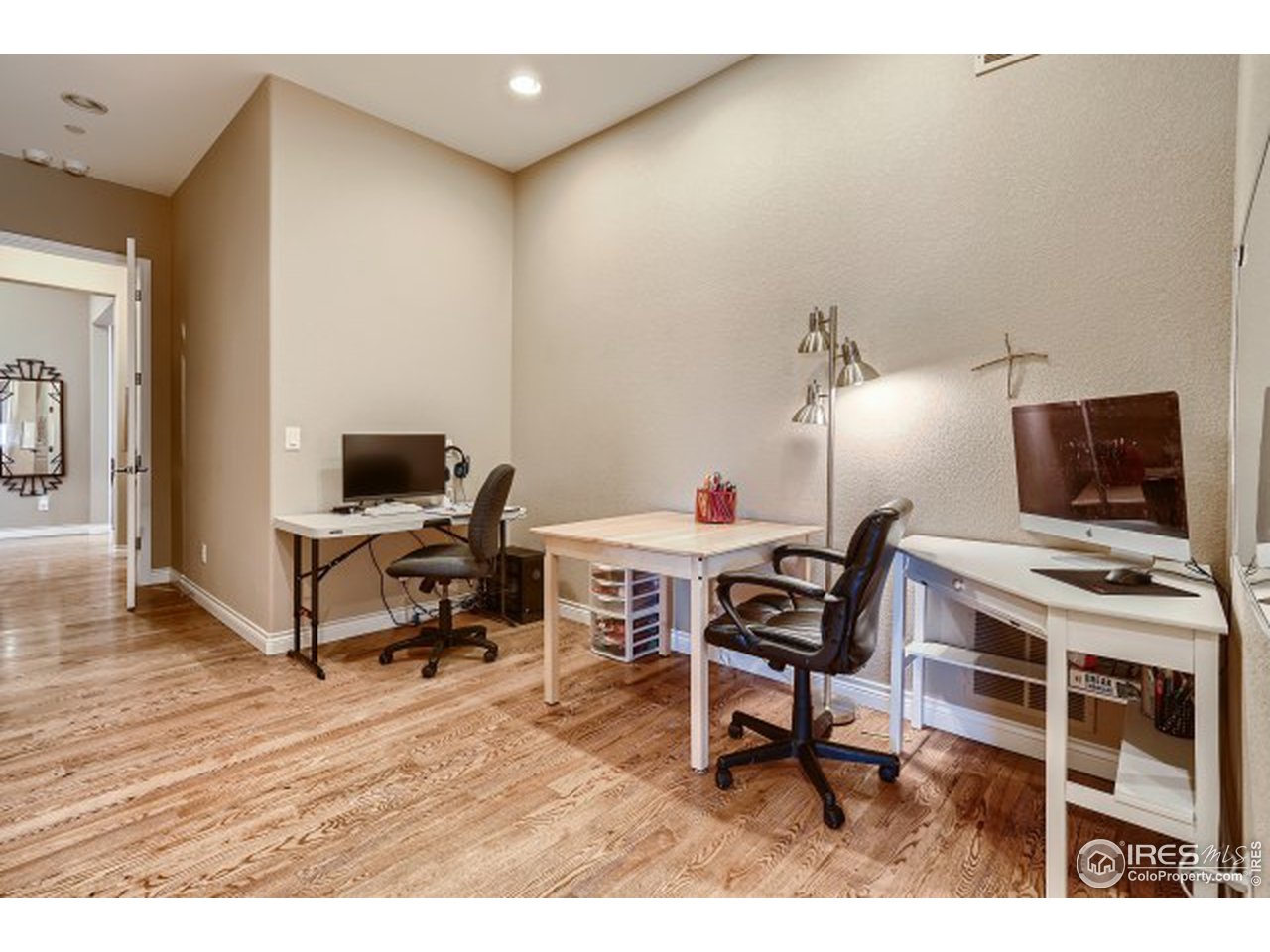 9670 Phillips Road Lafayette, CO 80026 - Photo 20 of 33 a living room with furniture and a flat screen tv