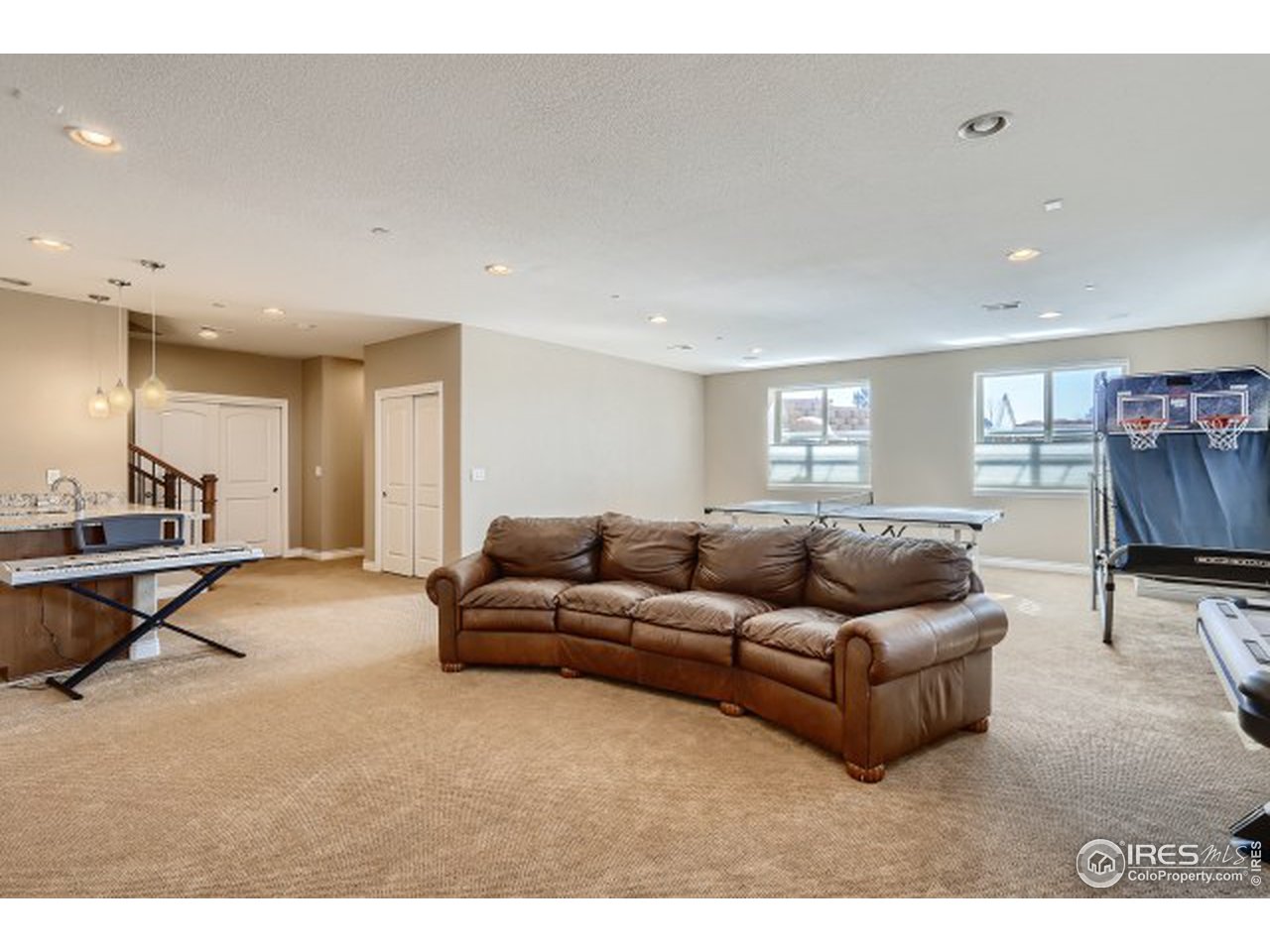 9670 Phillips Road Lafayette, CO 80026 - Photo 27 of 33 a living room with furniture and a flat screen tv